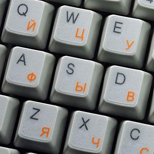 Adesivo russo do teclado cirílico com um fundo transparente de letras laranja